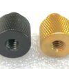 1/4" female to 3/8" male thread adapter (Left: Black Aluminium. Right: Brass)